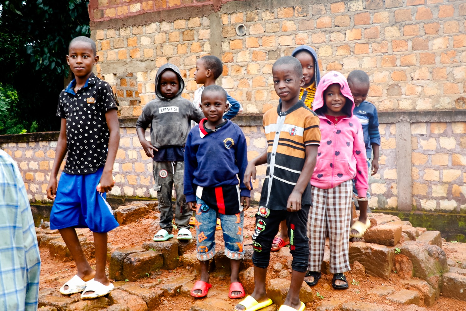 A group of children pose for a photo in a small village in Guinea